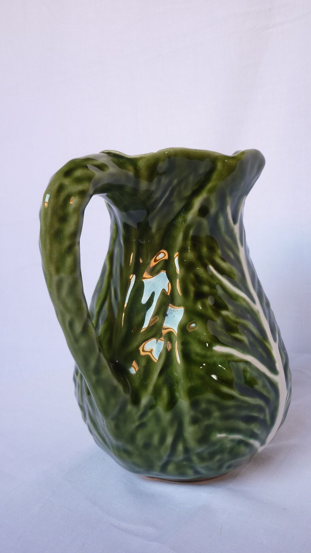 Pitcher dabbling cabbage leaf