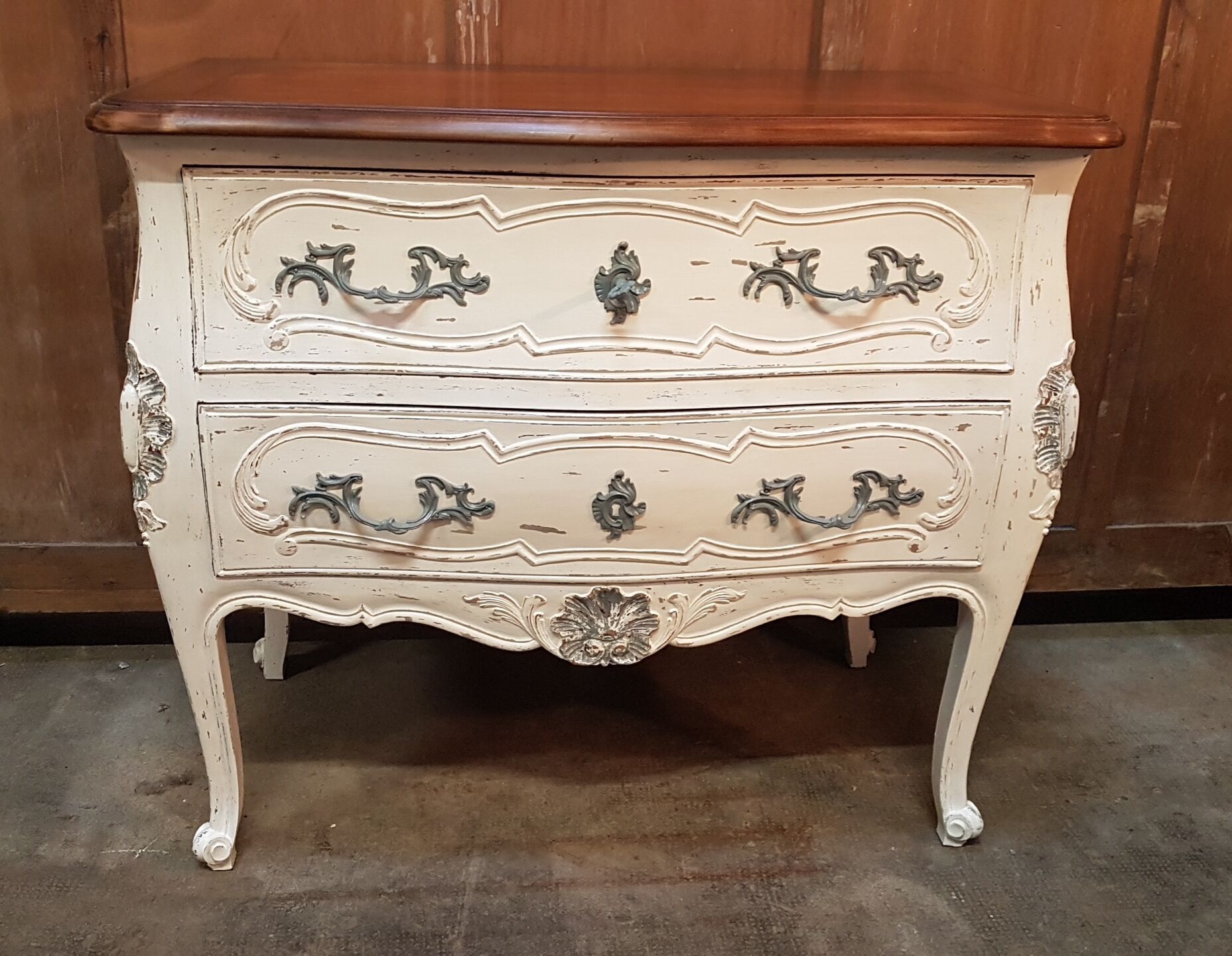 Beautiful curved chest of drawers in patinated Louis XV style