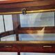 Art Deco service trolley in mahogany, brass, and glass, 1920.