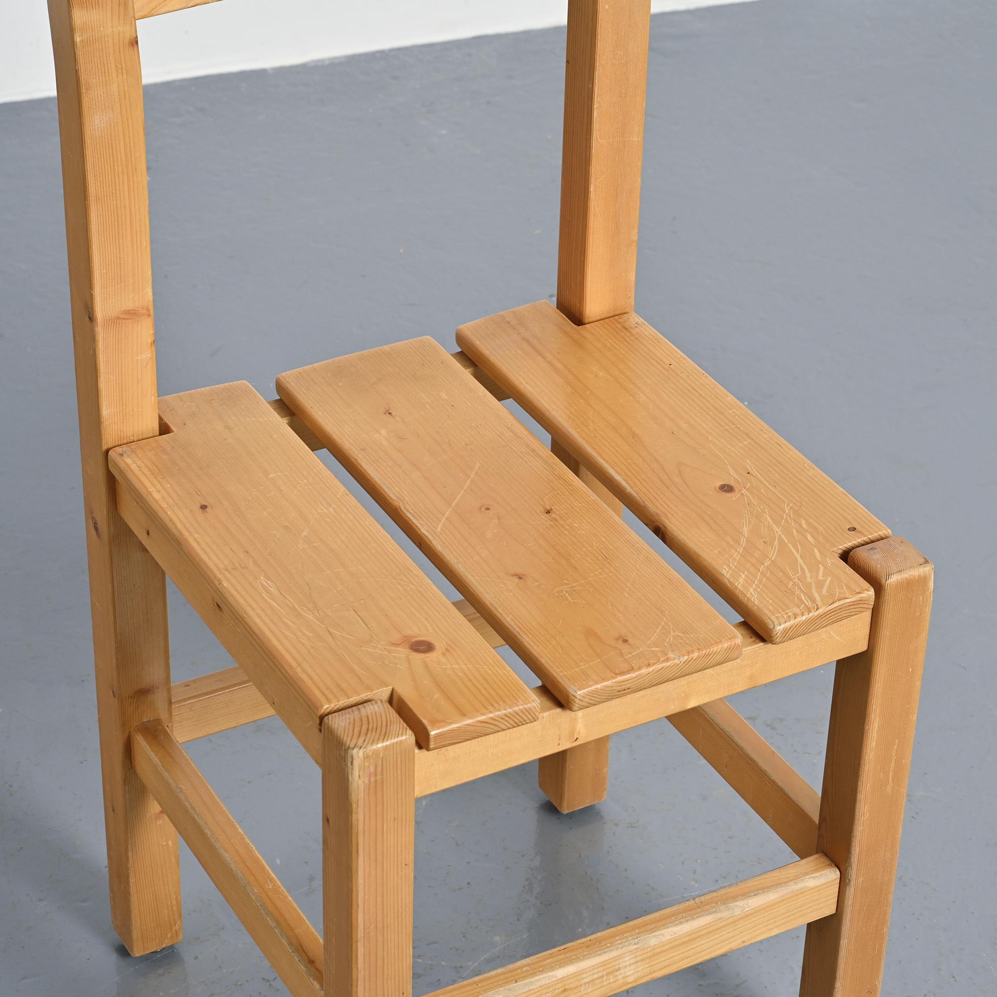 Set of four solid pine chairs by Maison Regain.