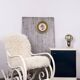 Antique Thonet rocking chair in ivory lacquered bent wood, with a white lamb fur seat.
