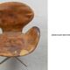 Brown leather Swan chair by Arne Jacobsen, mid-century Danish modernity.