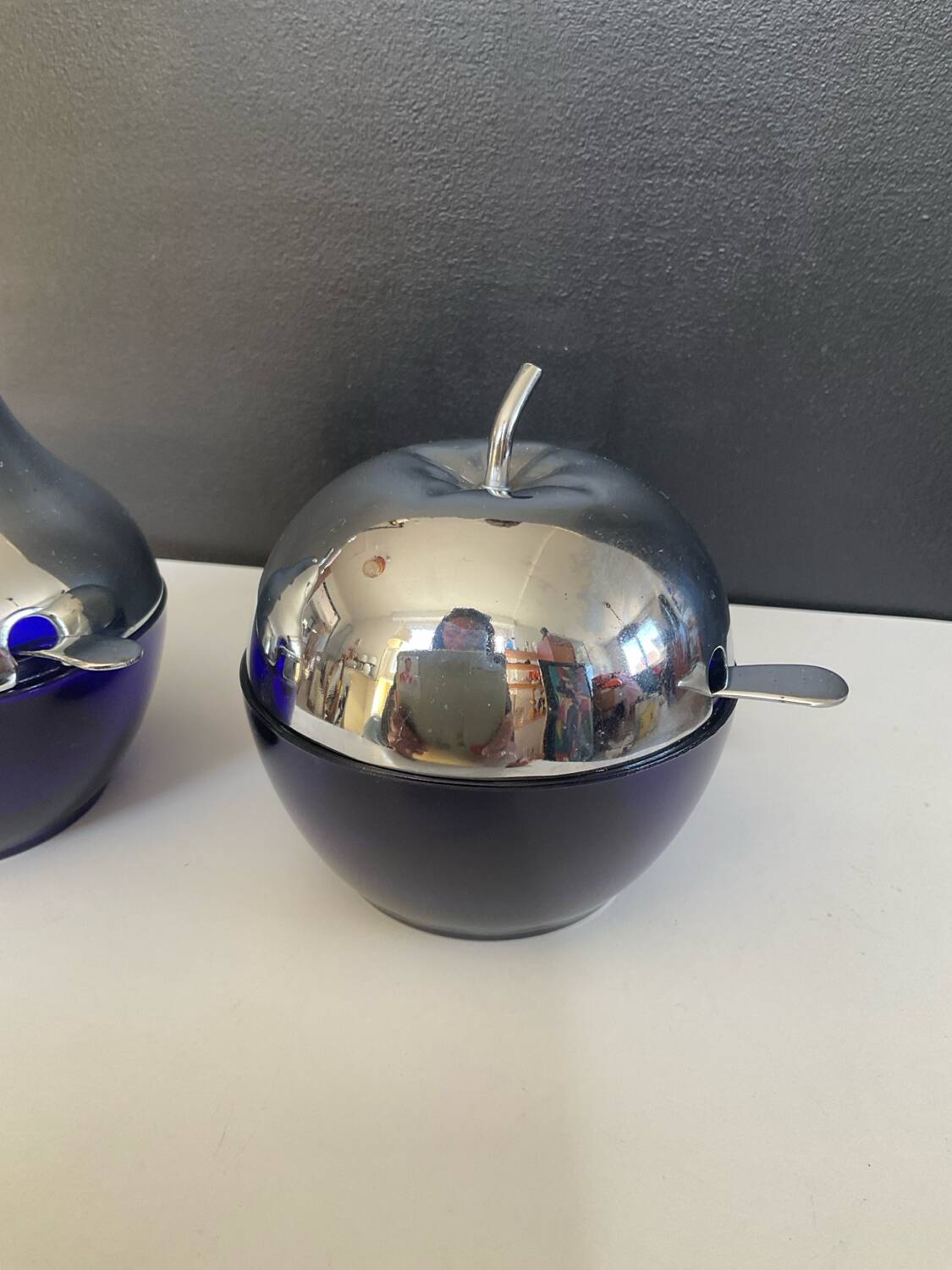 A pair of vintage cobalt glass and silver-plated sugar bowls.