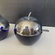 A pair of vintage cobalt glass and silver-plated sugar bowls.