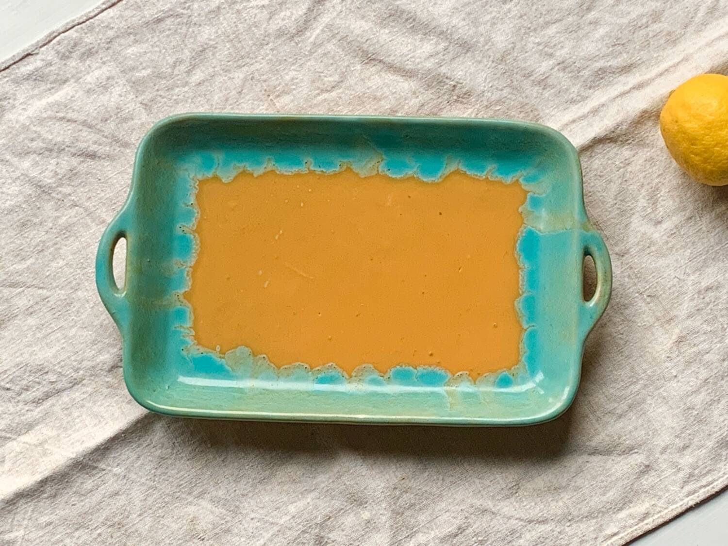CAB turquoise and ochre ceramic dish with handles