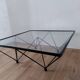 Glass coffee table with a metal frame.