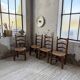 Set of 4 oak and straw chairs Dudouyt 1940
