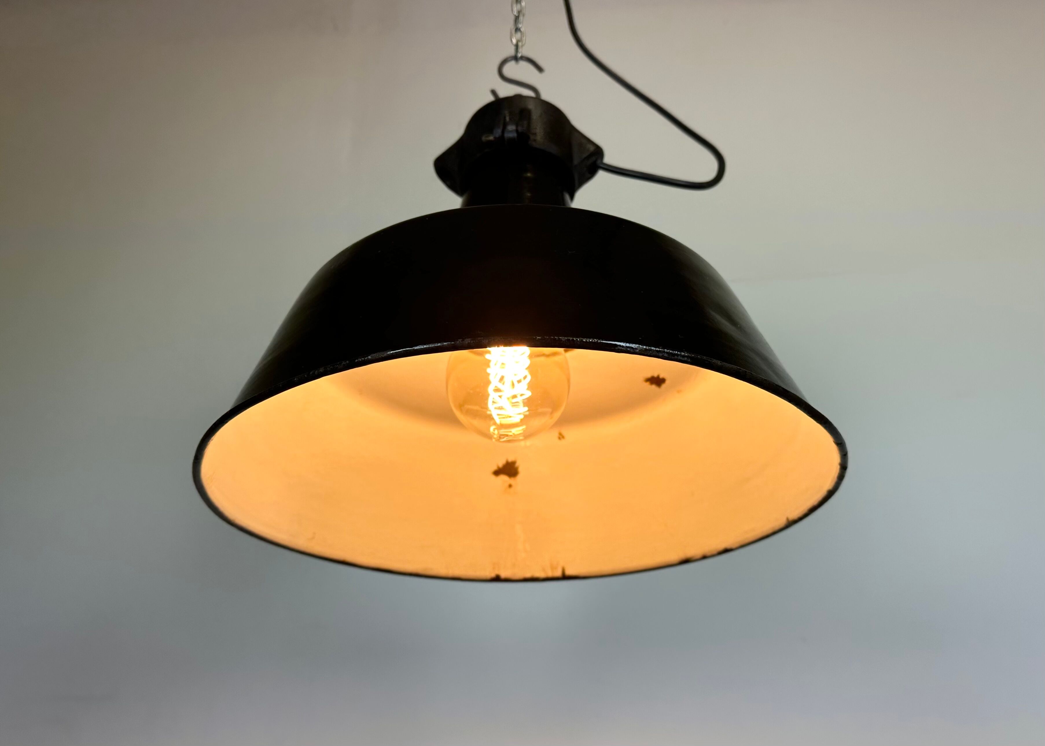Industrial black enamel factory lamp with cast iron top, 1960s