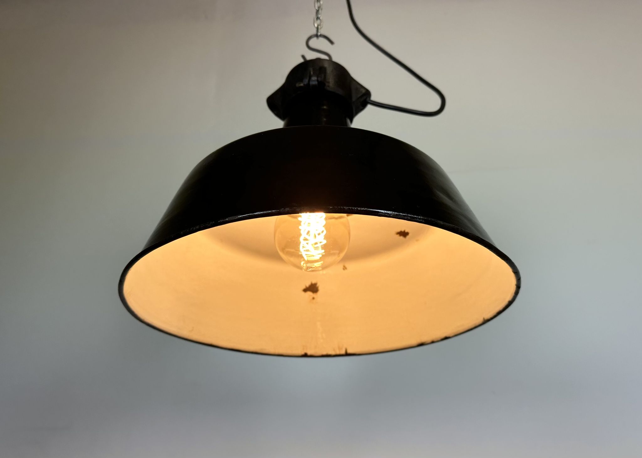 Industrial black enamel factory lamp with cast iron top, 1960s