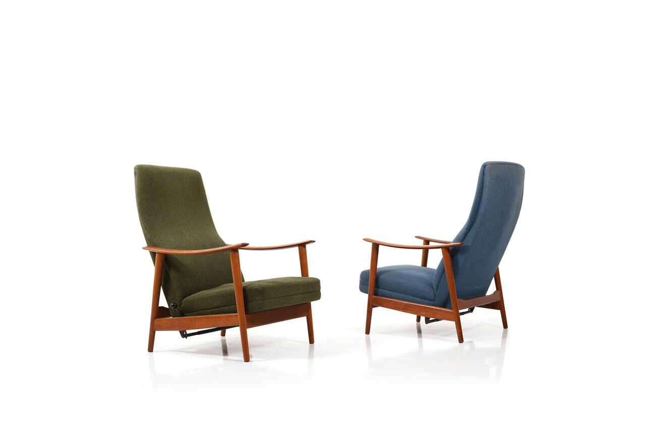 Pair of mid century Danish reclining lounge chairs in teak