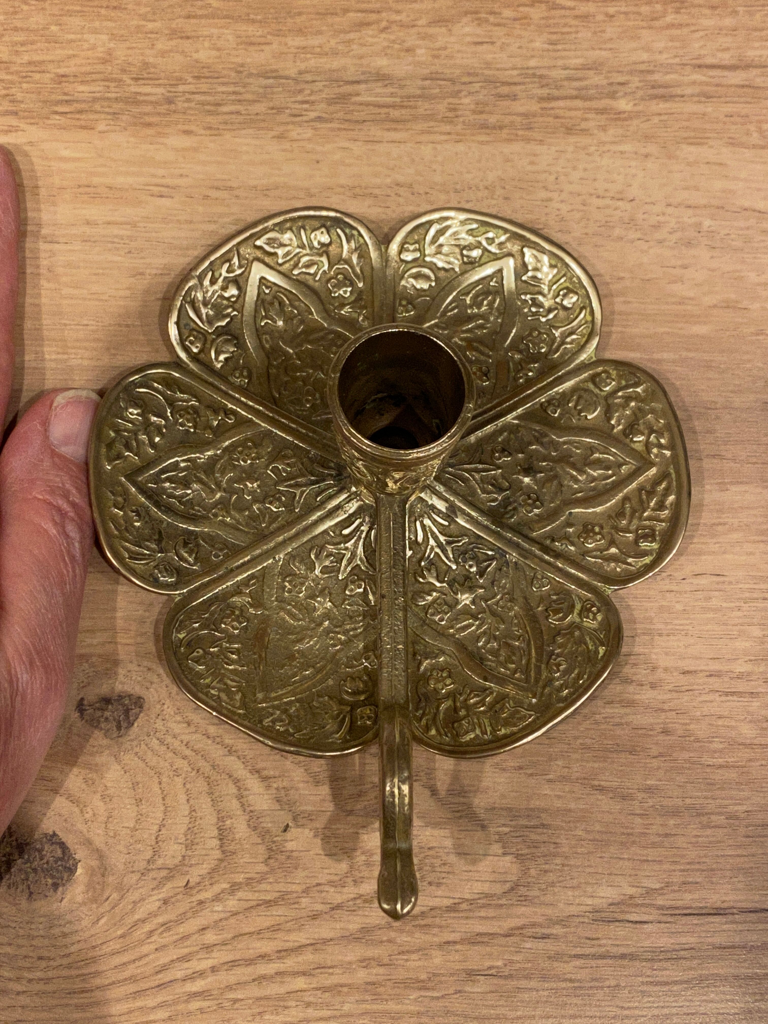 Brass candle holder on frame