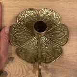 Brass candle holder on frame