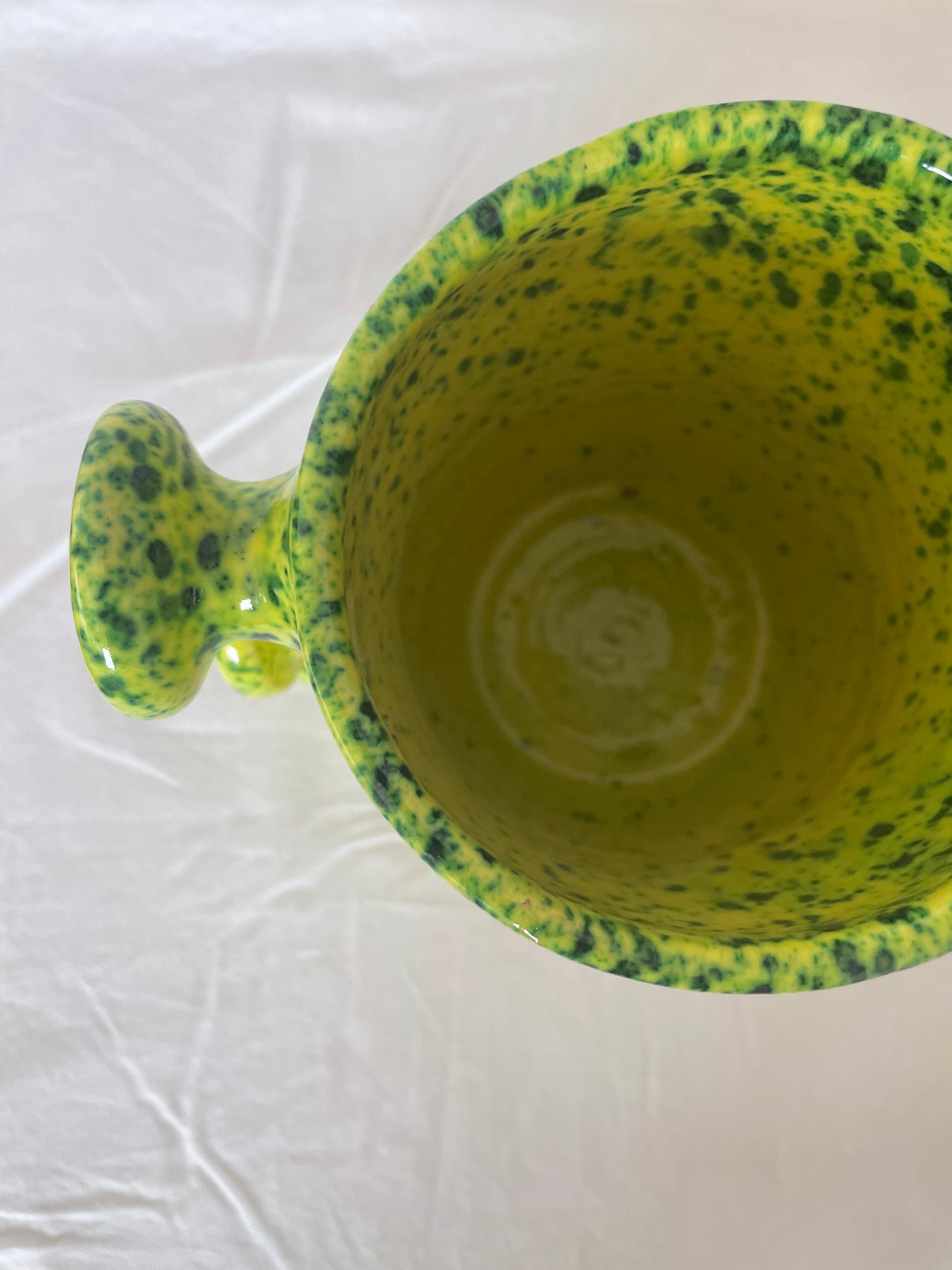 Handmade green speckled yellow ceramic vase with abstract handles