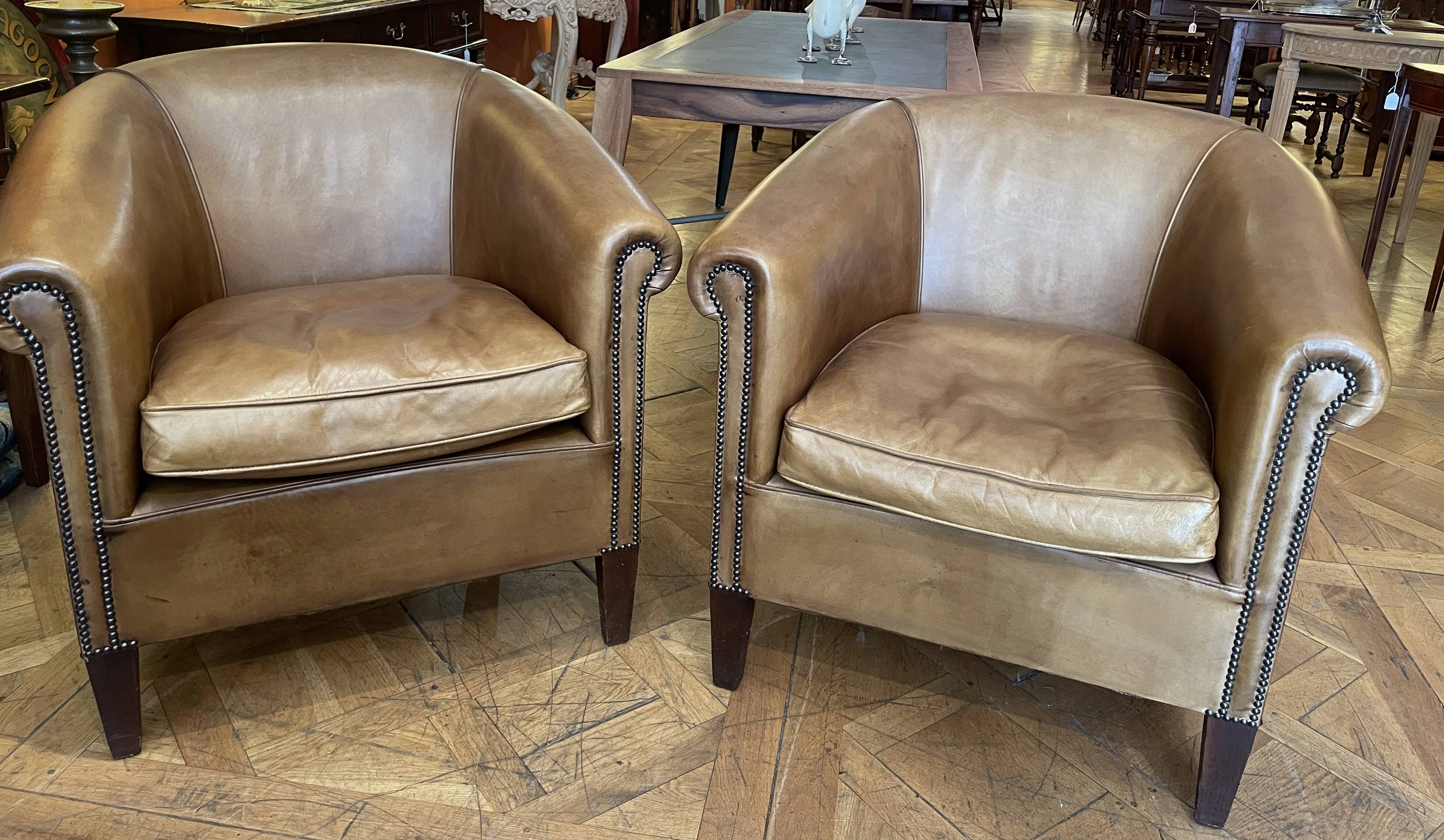 pair of camel leather club armchairs