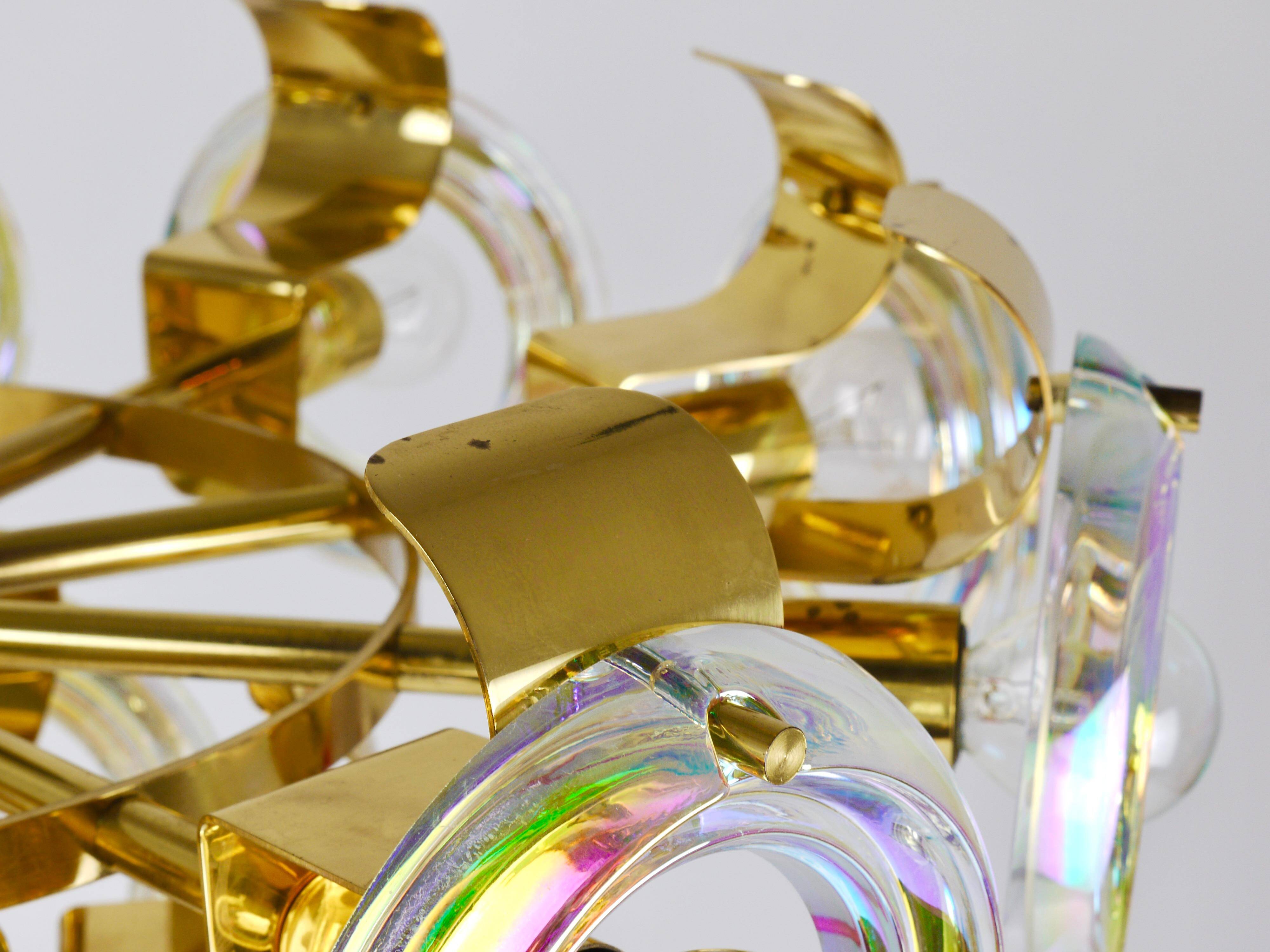 Large brass chandelier by Oscar Torlasco, rainbow optical glass rings, Italy, 1970s.