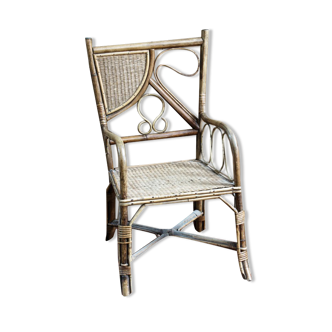 Asymmetrical rattan armchair