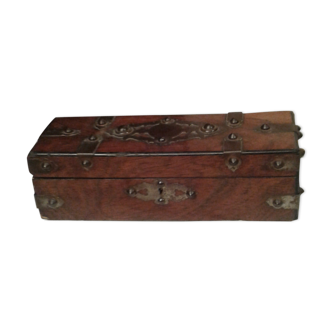 Old studded wooden box adorned with flat iron