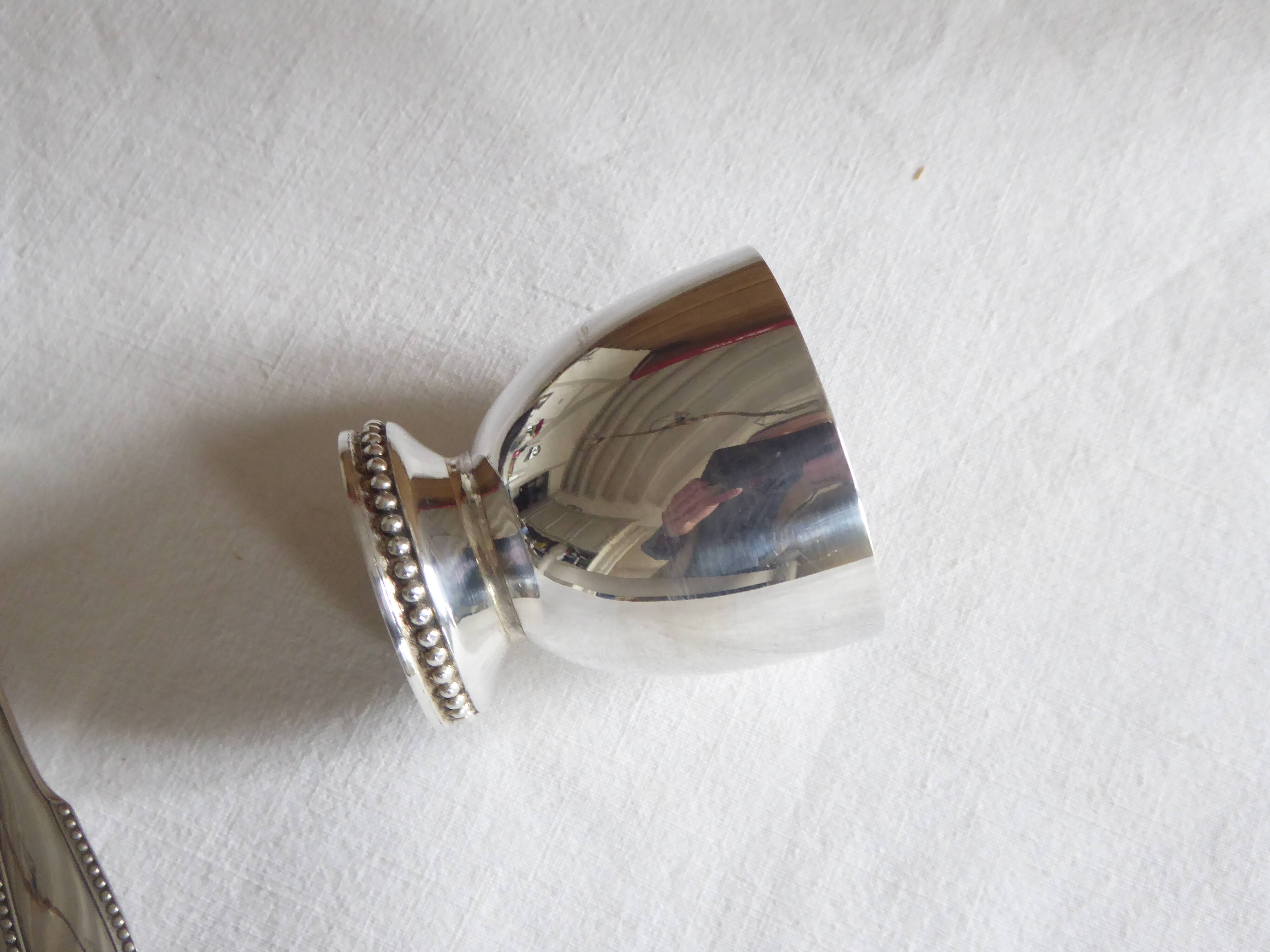 Cockerel + silver metal spoon