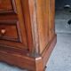 Cherry nightstand with pink marble.