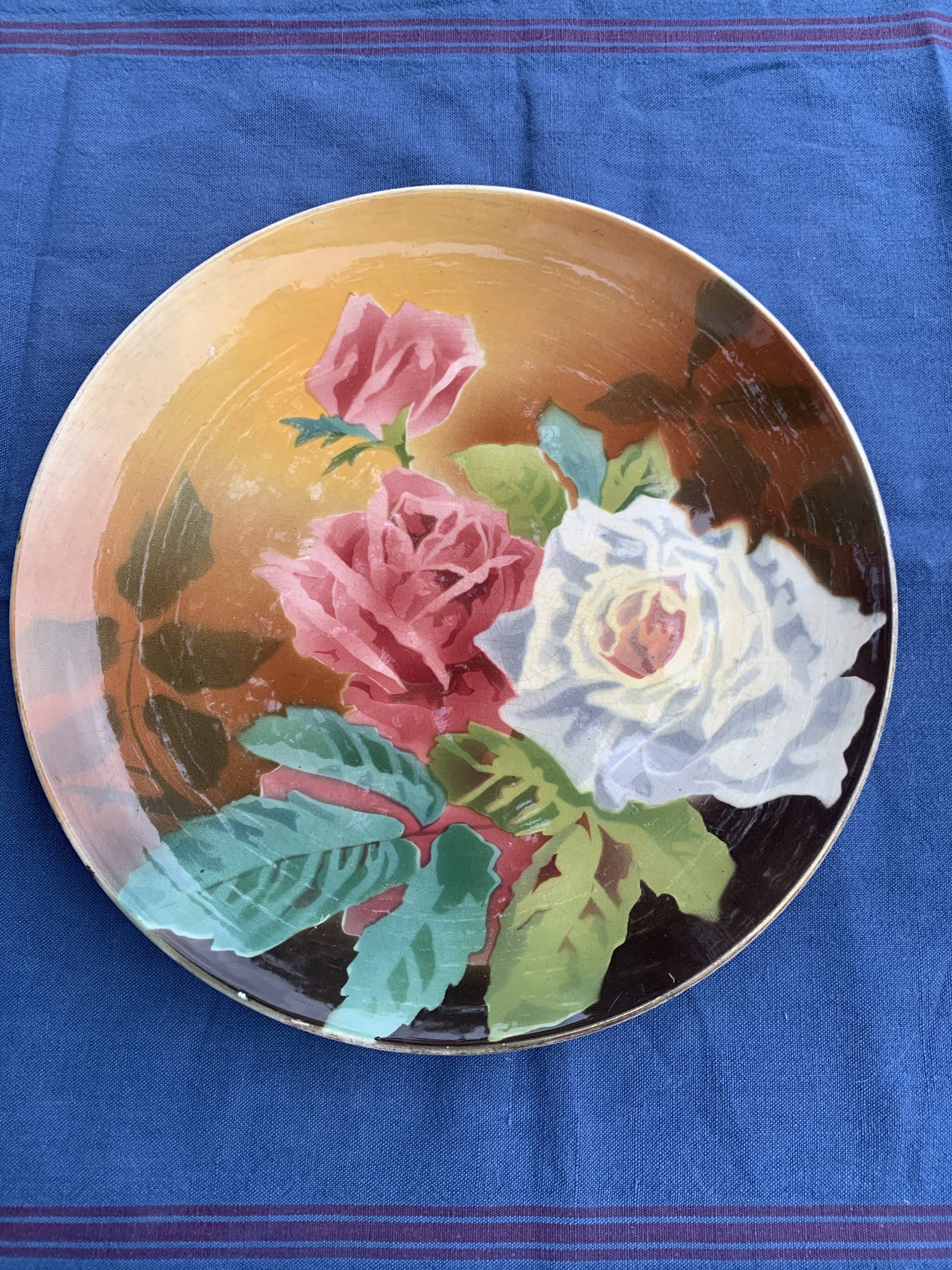 Plate with iron rose motifs, hb, Choisy le roi art deco