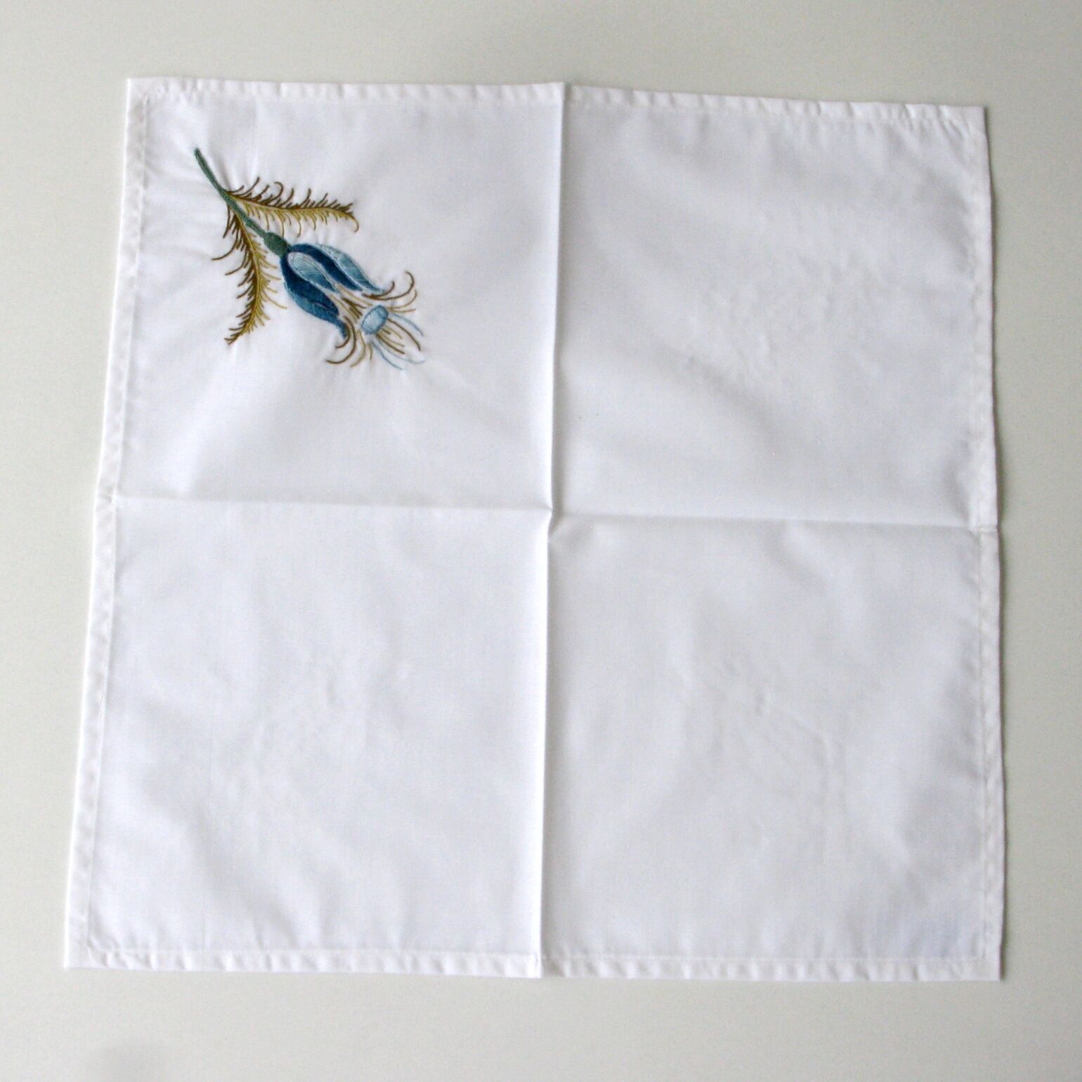 Antique rectangular hand-embroidered tablecloth decorated with thistle and 12 towels