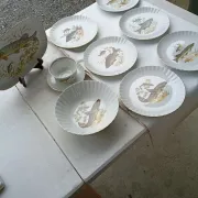 vintage porcelain dinner service with fish pattern and gold trim
