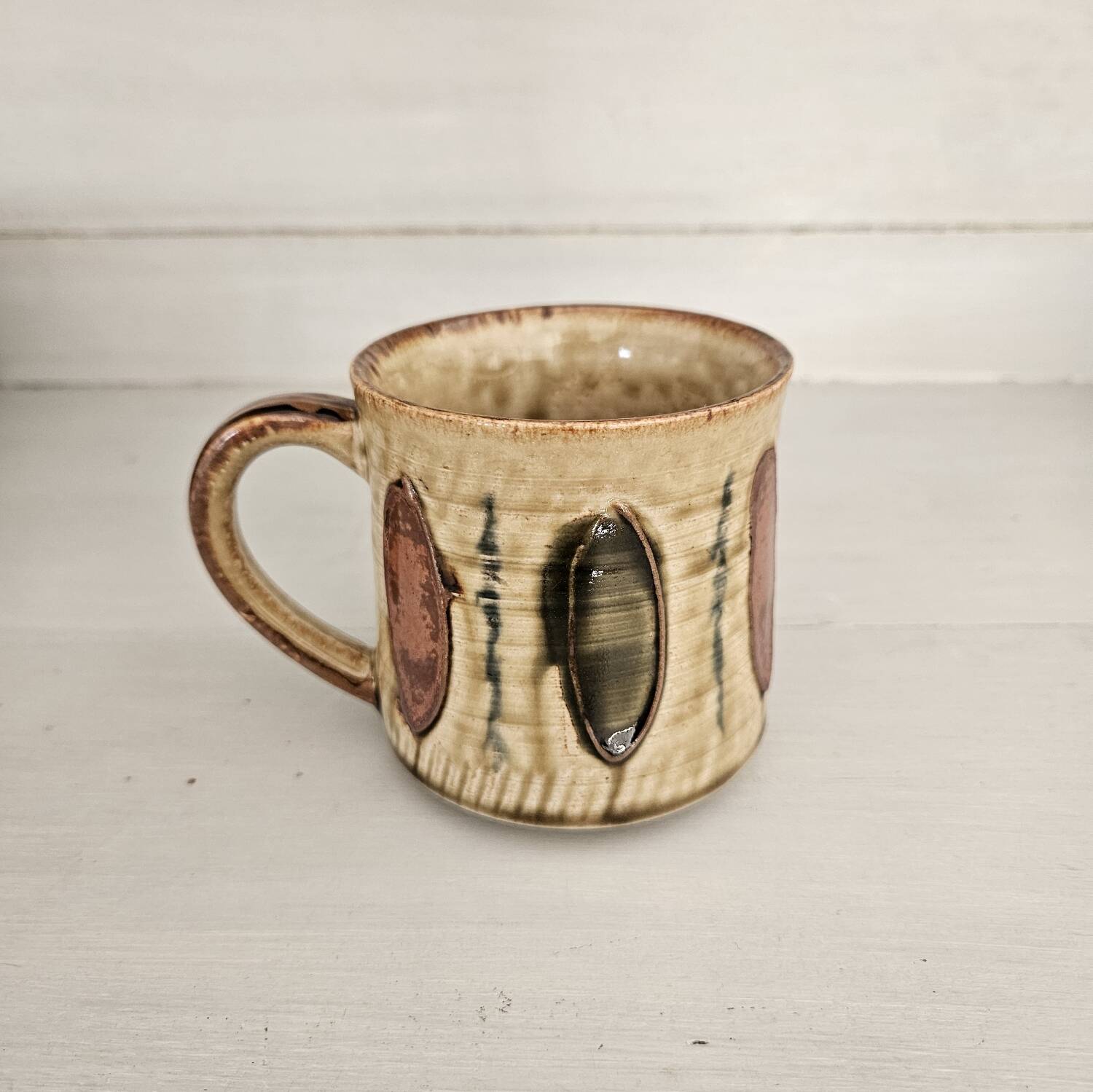 Set of 4 ceramic mugs, glazed stoneware, assorted vintage designs.
