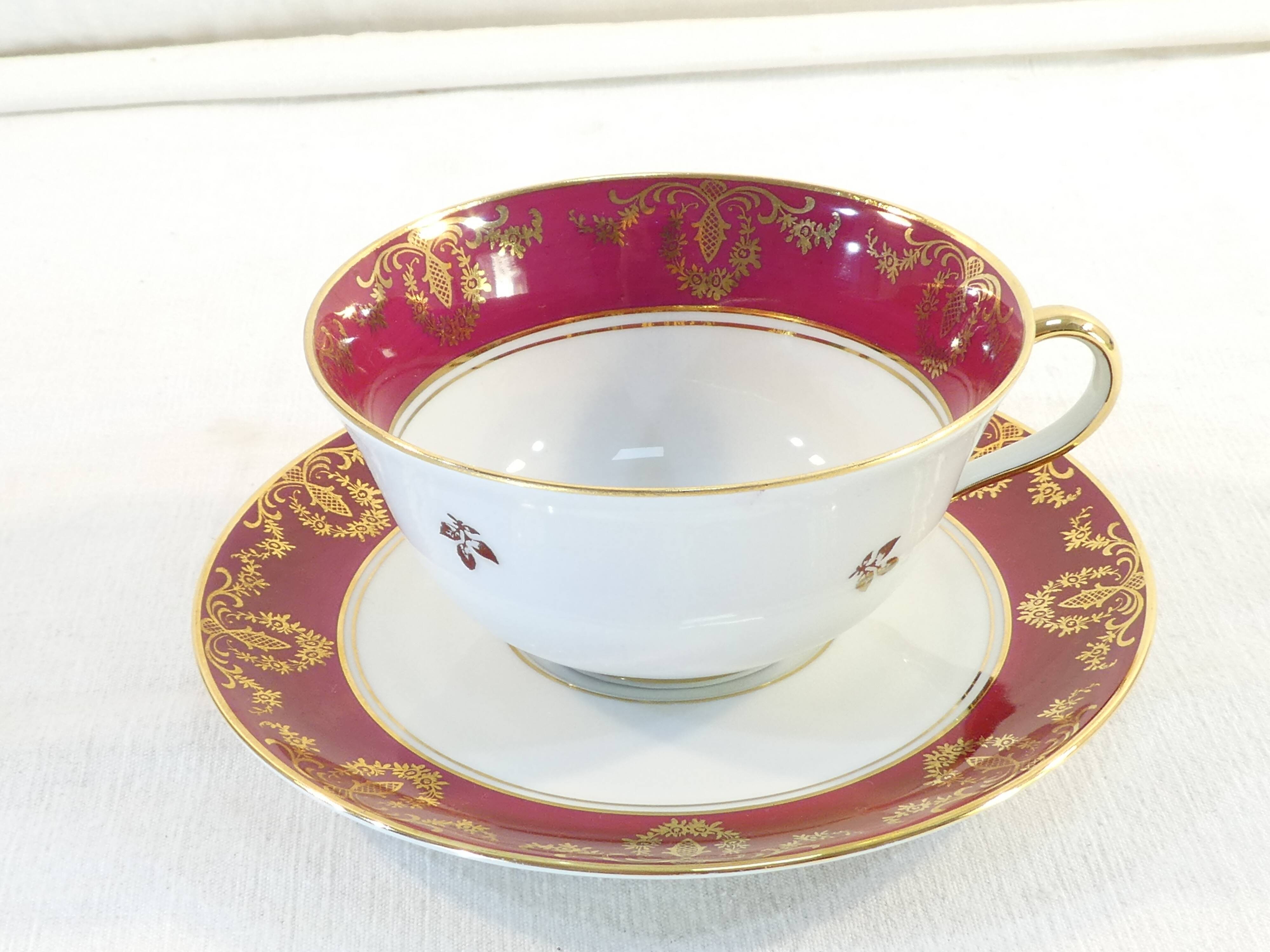 Pair of lunch cup and subcup in porcelain limoges red headband