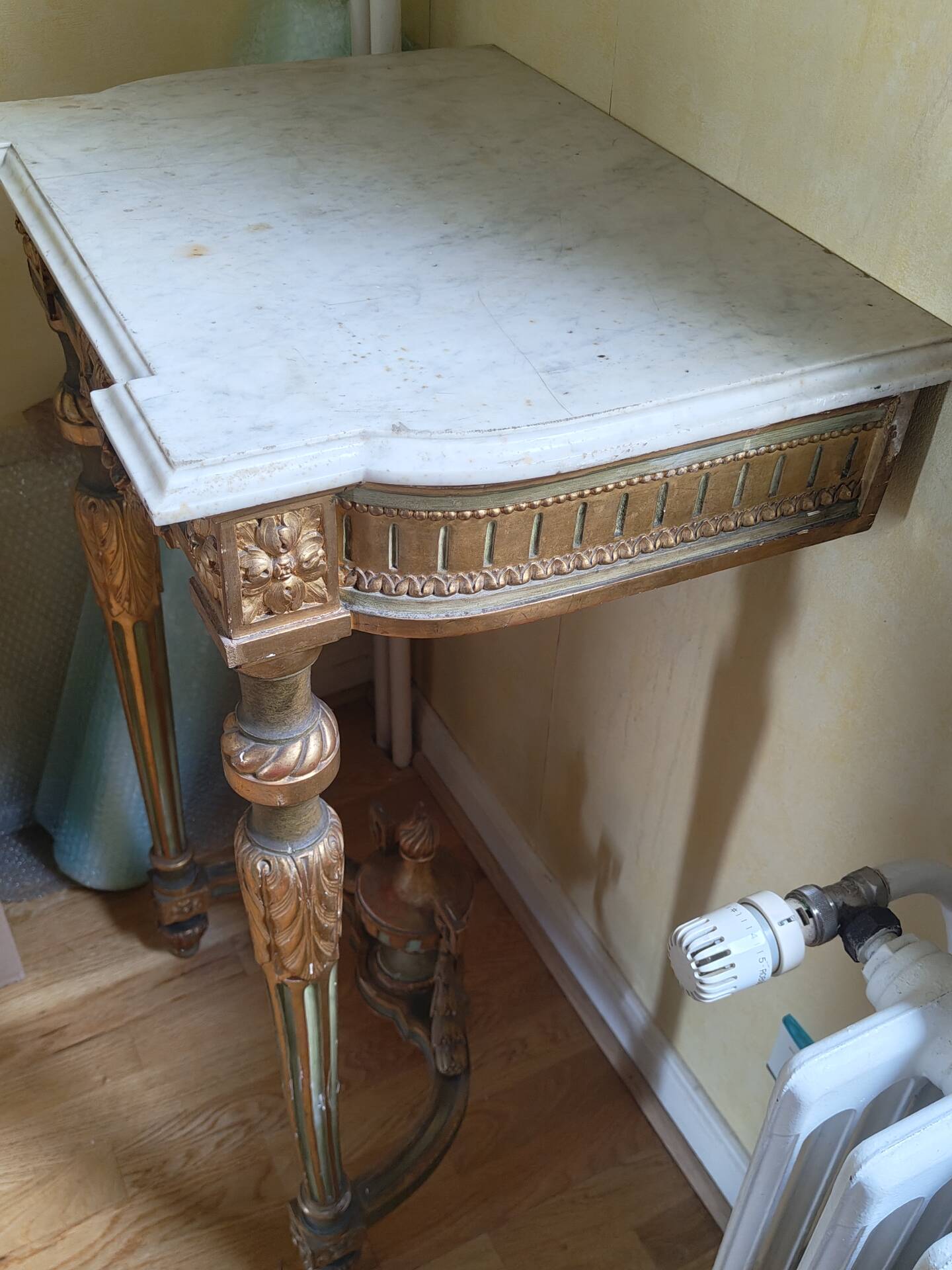 Golden wood and marble console in neoclassical style