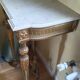 Golden wood and marble console in neoclassical style