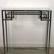 Art Deco style console in chromed metal with glass top