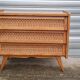 Commode vintage pied compas et rotin