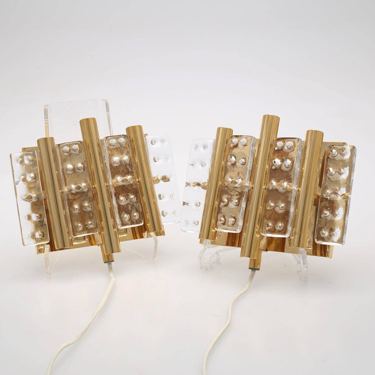 HANS AGNE JAKOBSSON. A pair of glass and brass wall lights