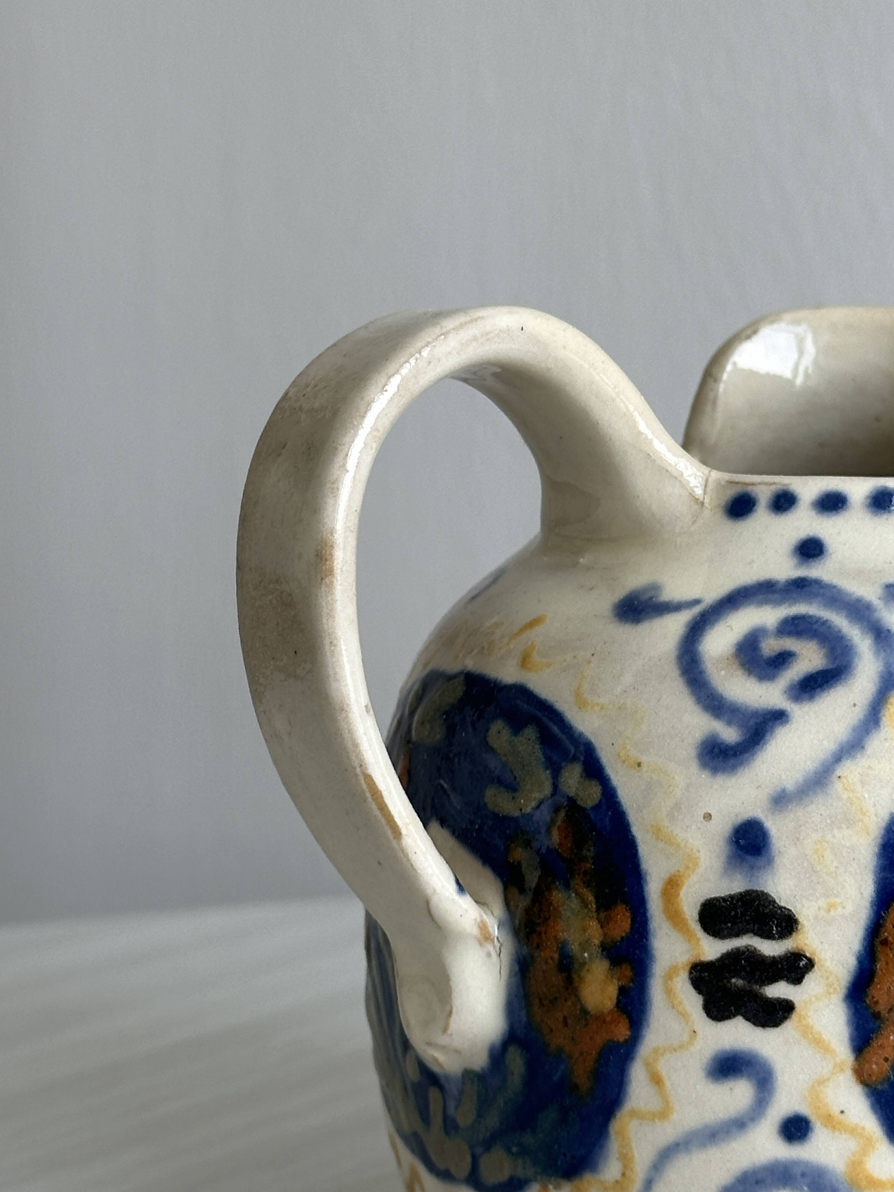 Hand painted ceramic decorative pitcher