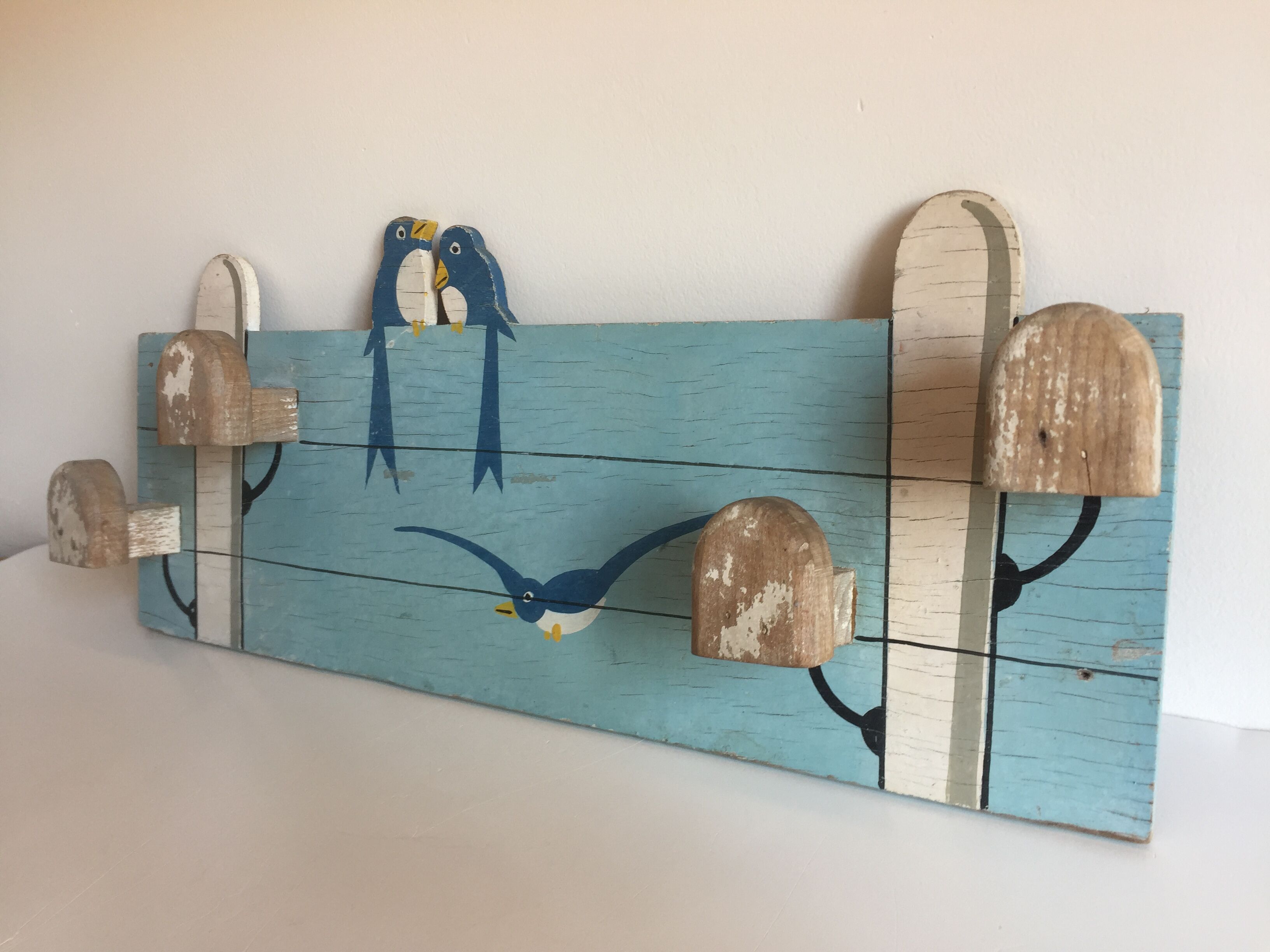 Coat rack with vintage swallows