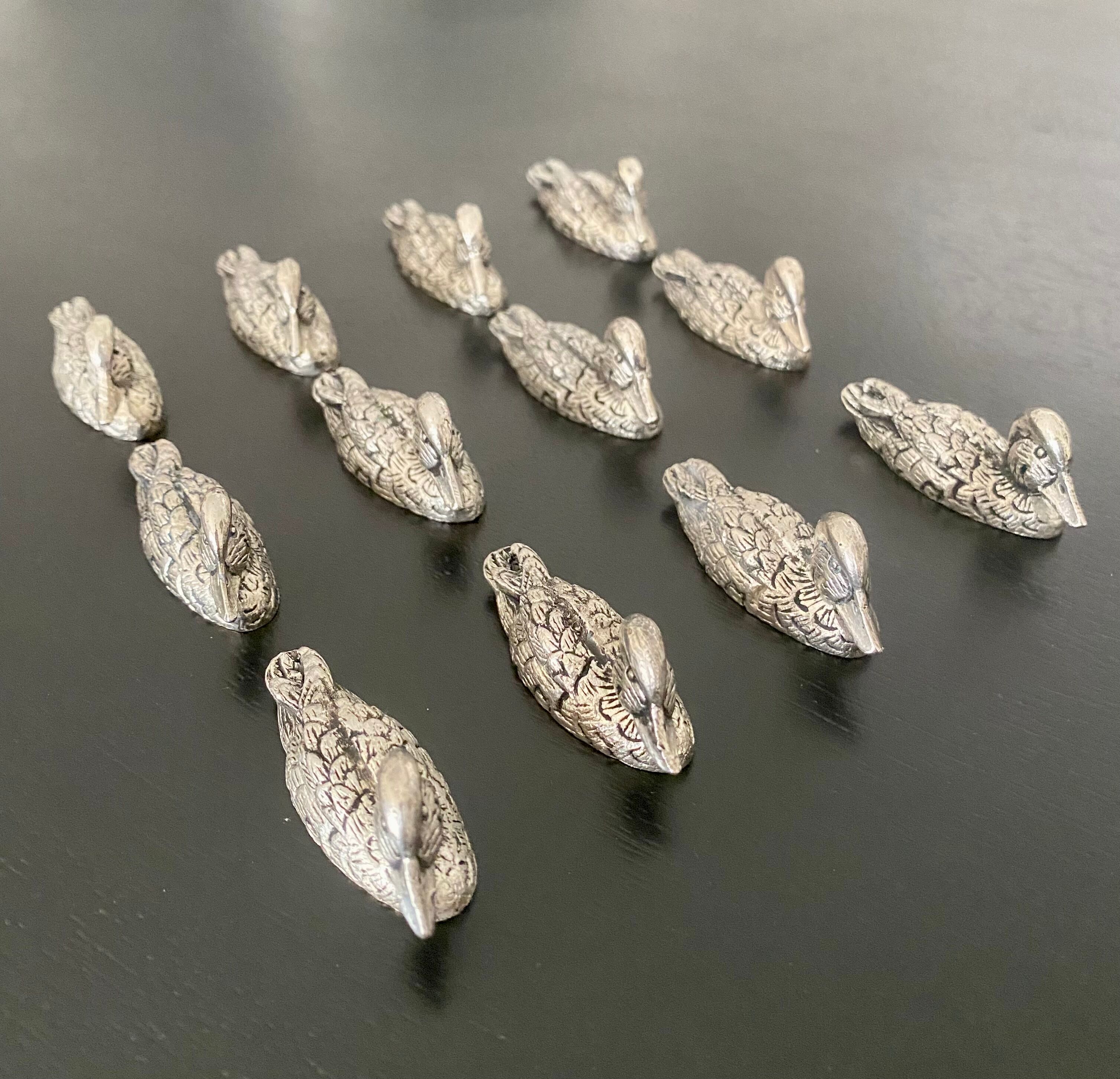 12 metal duck-shaped knife holders
