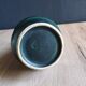 Vintage ceramic pitcher vase in glazed green and blue.
