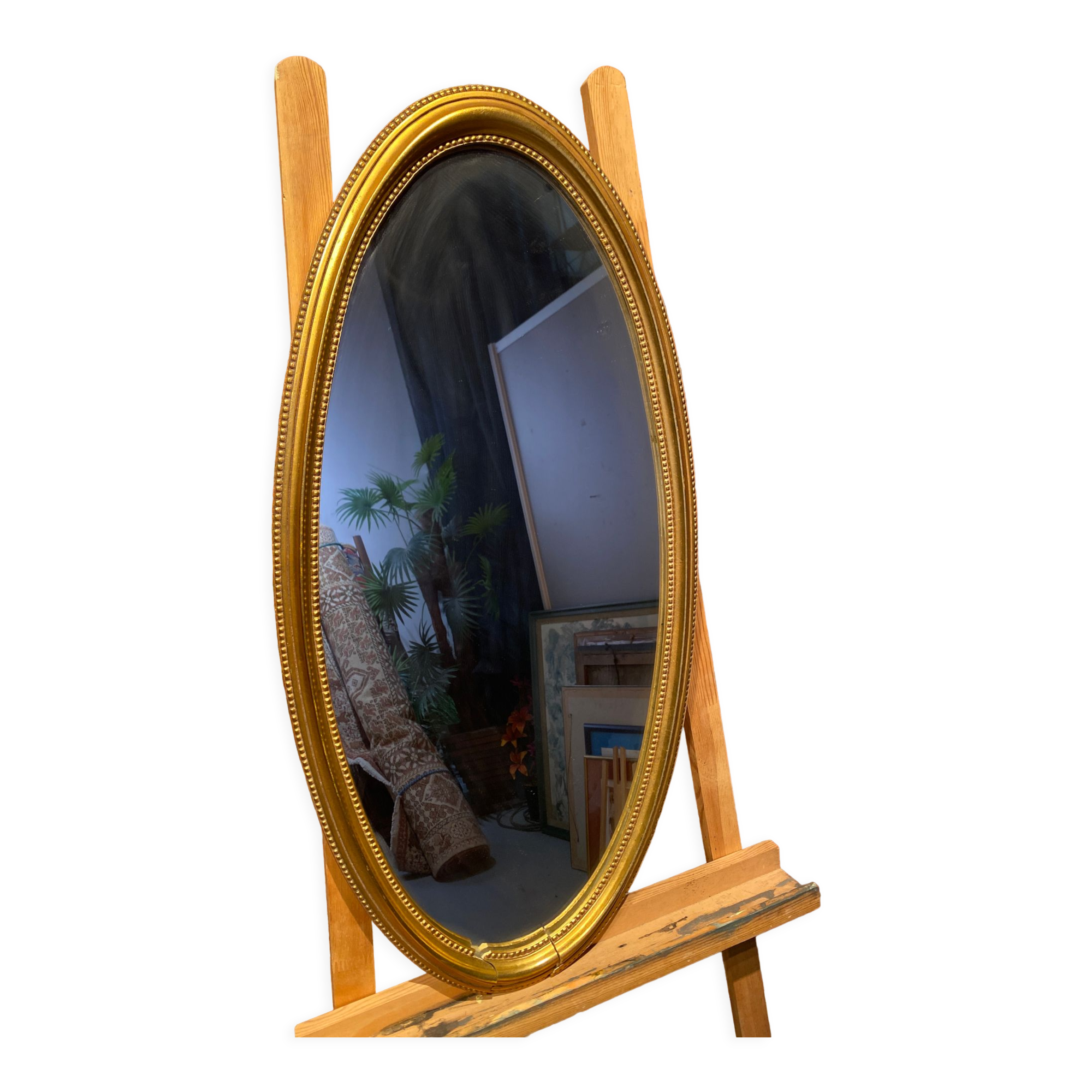 Oval mirror in a frame