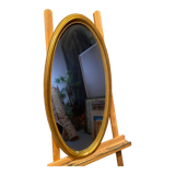 Oval mirror in a frame
