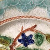 Old barbotine dessert plate. Floral patterns