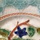 Old barbotine dessert plate. Floral patterns