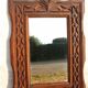 Tramp Art mirror from the 19th century in hand-carved wood.