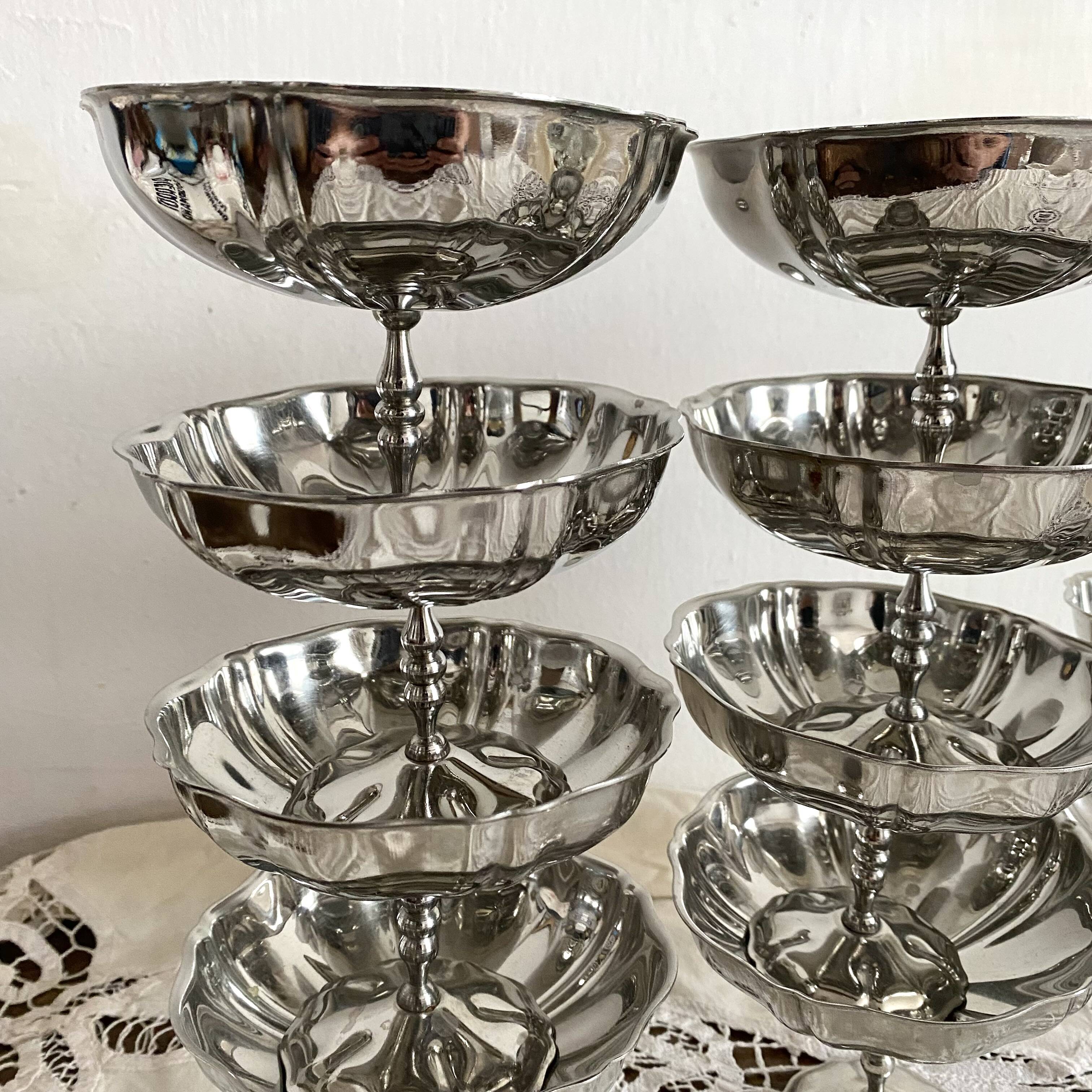 Vintage stainless steel cups on foot