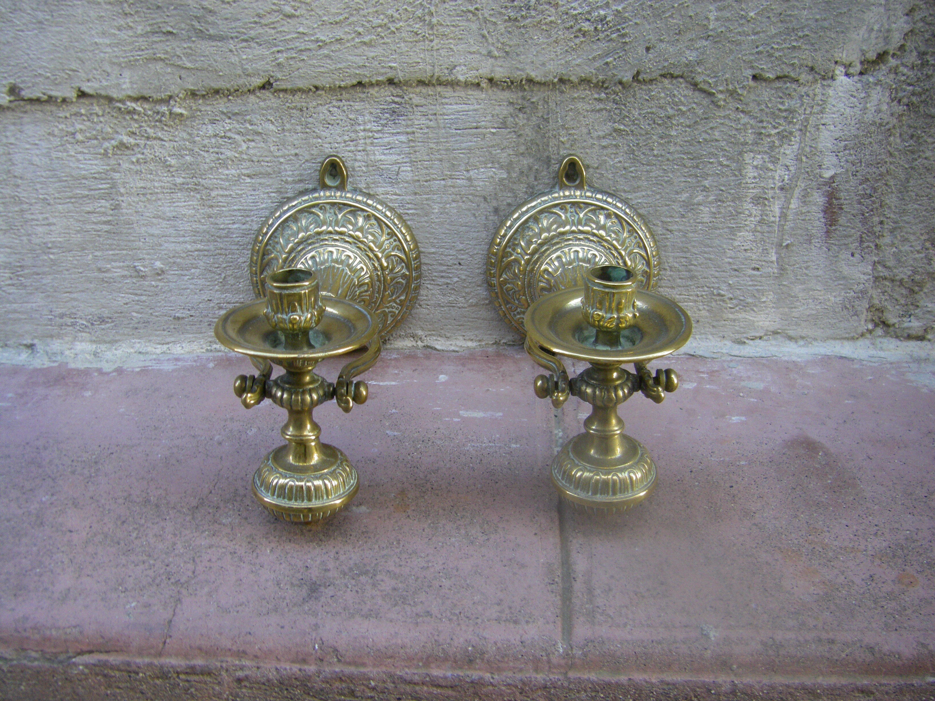 Pair of pendulum candle holders