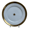 Assiettes en porcelaine de bruxelles. bord dorée et étoile dorée au centre.