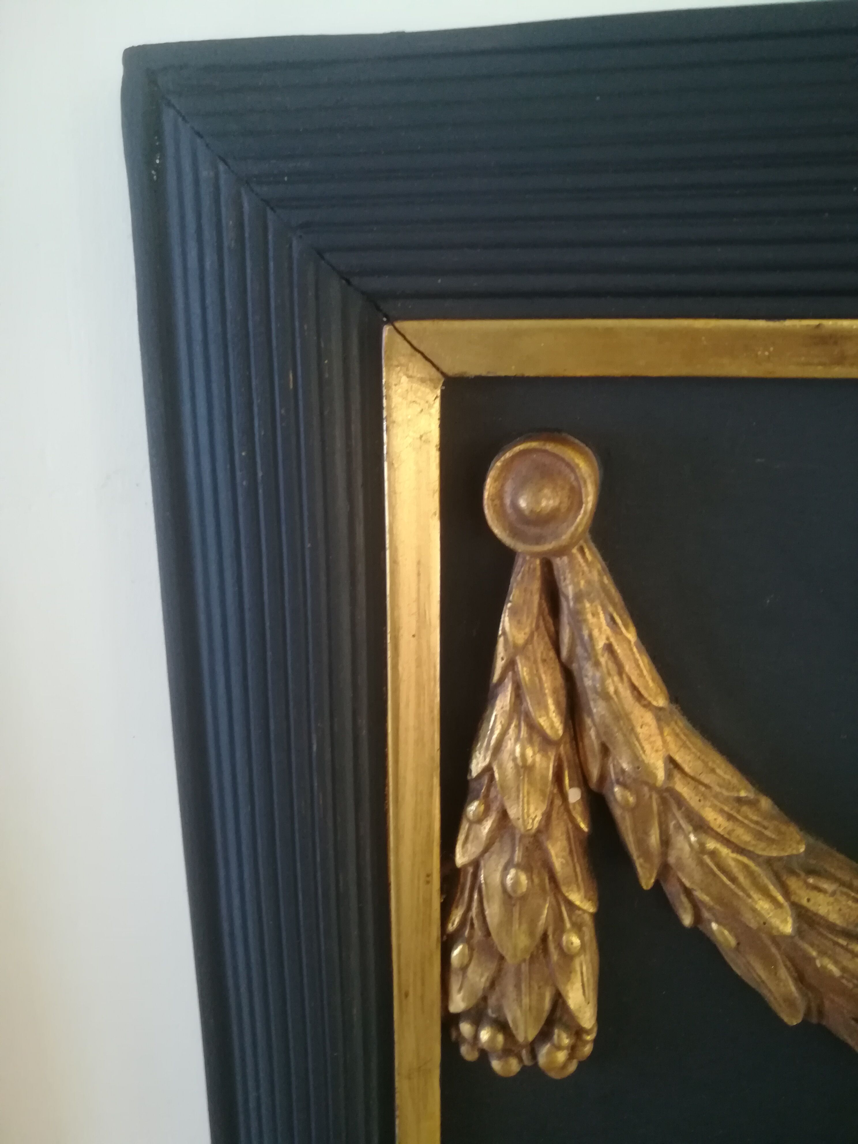 Trumeau louis XVI style mirror in black and gold stucco