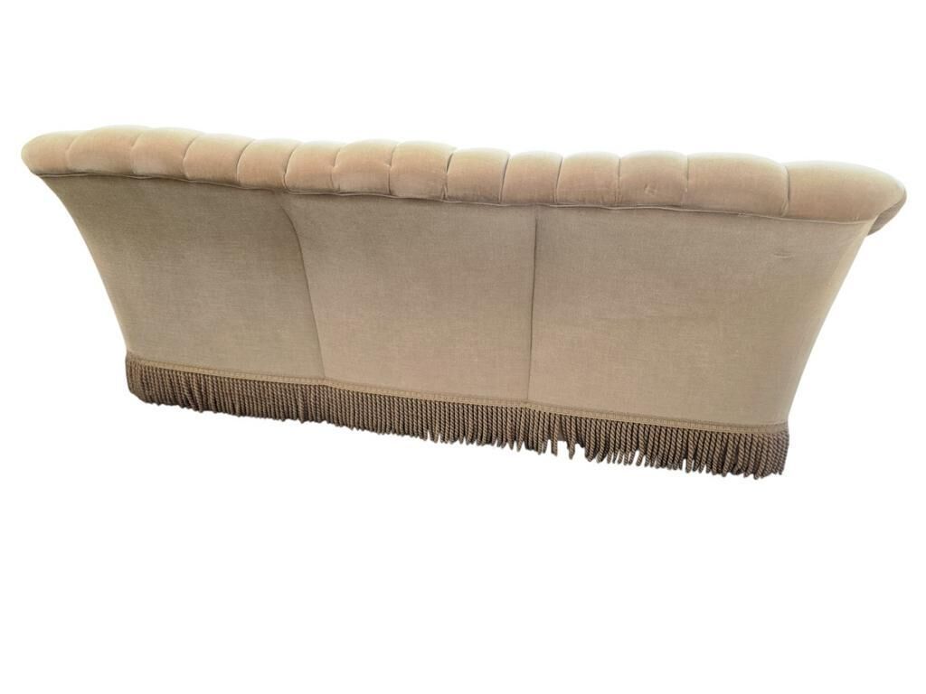 Canapé vintage beige avec franges