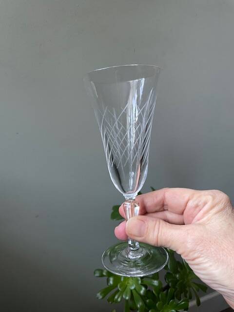 2 antique blown glass champagne flutes, tulip shape.