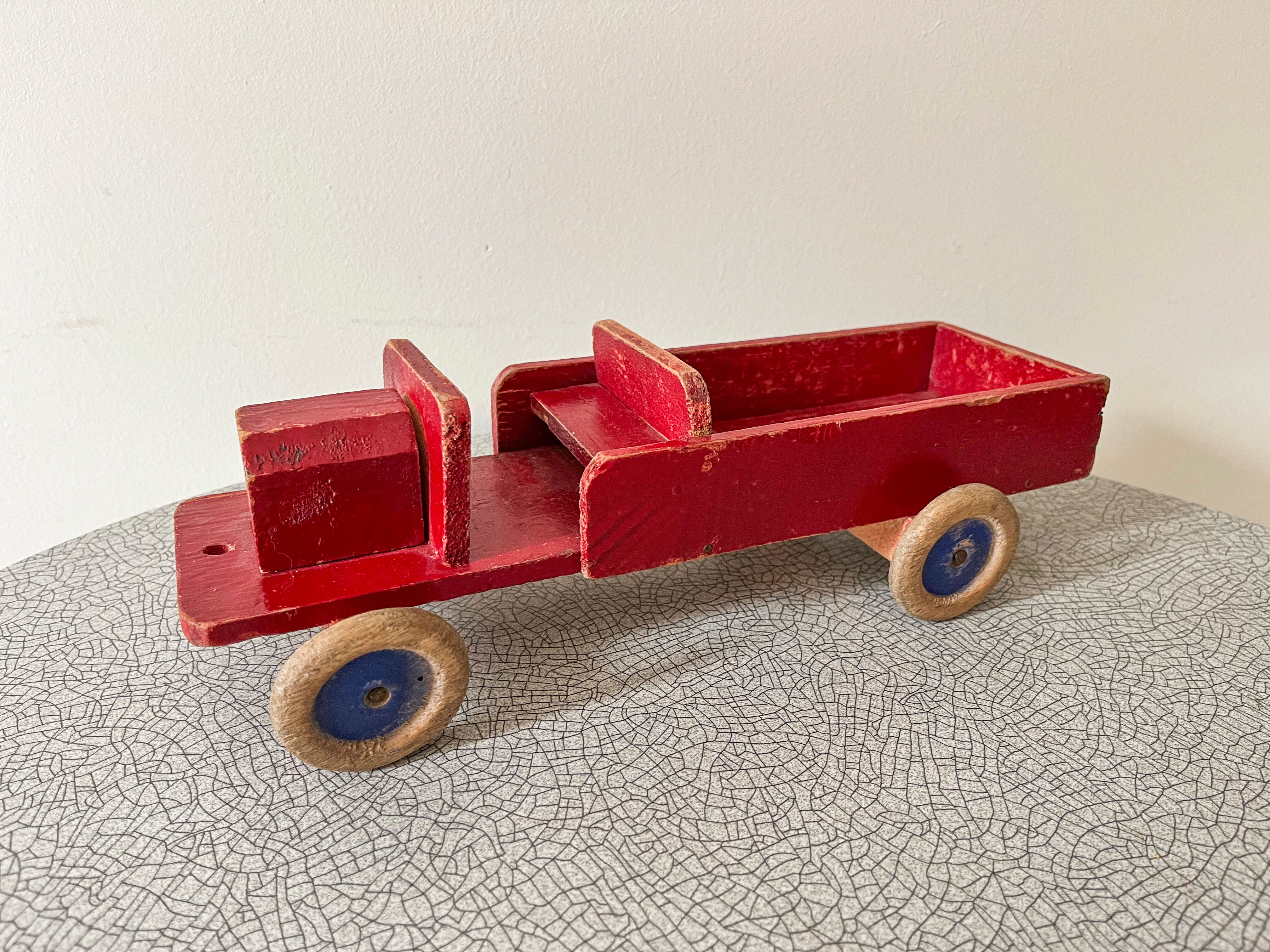 Red wooden flatbed truck. 1930s-40s