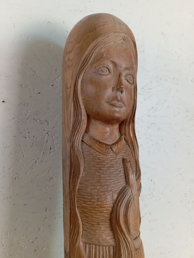 Sculpture of a young woman by Ray Boterf.